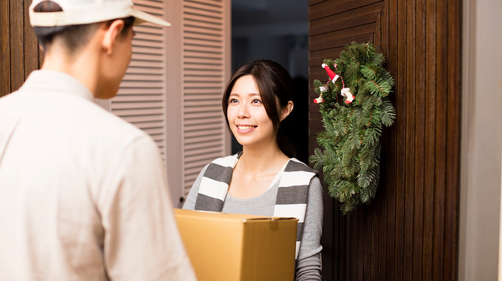 How to save money on Christmas: a Christmas parcel being delivered